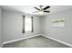 Bright bedroom featuring neutral walls, a window, and a modern ceiling fan at 870 Live Oak Ln, Nashville, NC 27856