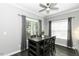 Bright dining room with hardwood floors, modern furnishings, and natural light from windows at 870 Live Oak Ln, Nashville, NC 27856