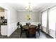 Cozy dining room featuring wainscoting, chandelier lighting and hardwood flooring at 870 Live Oak Ln, Nashville, NC 27856