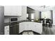 Stylish kitchen with white cabinets, granite counters, stainless appliances, and eat-in dining at 870 Live Oak Ln, Nashville, NC 27856