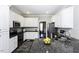 Modern kitchen featuring white cabinets, granite countertops, and stainless steel appliances at 870 Live Oak Ln, Nashville, NC 27856