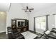 Comfortable living room featuring vaulted ceiling, ceiling fan and leather furniture at 870 Live Oak Ln, Nashville, NC 27856