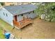 Backyard view showcasing the wooden deck and patio area perfect for outdoor living and entertaining at 1007 Ancroft Ave, Durham, NC 27713