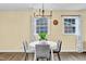 Sunlit dining area featuring modern chandelier and stylish decor at 1007 Ancroft Ave, Durham, NC 27713