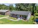 Charming single-story home with a well-maintained lawn, red shutters and matching front door at 1007 Ancroft Ave, Durham, NC 27713