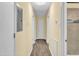 A brightly lit hallway features wood-look vinyl flooring and leads to various rooms at 1007 Ancroft Ave, Durham, NC 27713