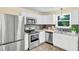 Modern kitchen featuring stainless steel appliances and sleek countertops at 1007 Ancroft Ave, Durham, NC 27713
