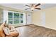Bright living room with hardwood floors, a ceiling fan, and large window at 1007 Ancroft Ave, Durham, NC 27713