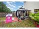 Cozy backyard featuring a gazebo, playhouse, patio, and verdant lawn, perfect for relaxation and play at 1030 Thoughtful Spot Ln, Durham, NC 27703
