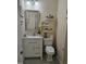 Charming bathroom features vanity with granite countertop, decorative mirror, and updated fixtures at 1030 Thoughtful Spot Ln, Durham, NC 27703