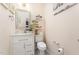 Powder room featuring vanity with storage and decorative shelving at 1030 Thoughtful Spot Ln, Durham, NC 27703