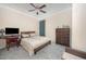 Inviting bedroom offering a ceiling fan, modern furnishings, and neutral carpeting at 1030 Thoughtful Spot Ln, Durham, NC 27703