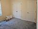 Cozy bedroom with neutral carpet, double closets, and natural light; perfect for Bedroom or guest room at 1030 Thoughtful Spot Ln, Durham, NC 27703