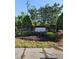 Entrance to Hanover Pointe featuring a brick sign surrounded by manicured landscaping and lush greenery at 1030 Thoughtful Spot Ln, Durham, NC 27703