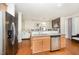 Kitchen featuring eat-in bar, stainless appliances and granite countertops at 1030 Thoughtful Spot Ln, Durham, NC 27703