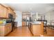 Eat-in kitchen with stainless appliances, granite countertops and wood cabinetry at 1030 Thoughtful Spot Ln, Durham, NC 27703