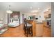Open-concept design features living room fireplace and bar seating at the kitchen counter at 1030 Thoughtful Spot Ln, Durham, NC 27703