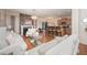 Open-concept layout with living room, kitchen and fireplace view at 1030 Thoughtful Spot Ln, Durham, NC 27703