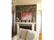 Inviting living room showcases a stone accent wall, fireplace, and ample natural light at 1030 Thoughtful Spot Ln, Durham, NC 27703