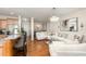Open-concept kitchen, living and dining area with hardwood floors and stylish decor at 1030 Thoughtful Spot Ln, Durham, NC 27703