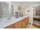 Well-lit bathroom featuring double sinks, decorative mirrors, and ample counter space at 1030 Thoughtful Spot Ln, Durham, NC 27703