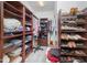 Organized walk-in closet offering ample storage space for clothing and shoes at 1030 Thoughtful Spot Ln, Durham, NC 27703