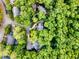 Aerial view showcasing homes nestled among mature trees, offering a sense of privacy and community at 104 Windorah Place Pl, Chapel Hill, NC 27517
