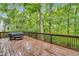 An outdoor patio deck overlooking the backyard and a wooded area at 104 Windorah Place Pl, Chapel Hill, NC 27517