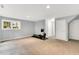 Finished basement space featuring neutral walls, carpet flooring, and natural lighting at 104 Windorah Place Pl, Chapel Hill, NC 27517