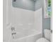 Bright bathroom showcasing a shower and a toilet with a window offering natural light at 104 Windorah Place Pl, Chapel Hill, NC 27517