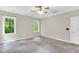 Spacious bedroom featuring carpet flooring, light walls, and natural light at 104 Windorah Place Pl, Chapel Hill, NC 27517