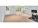 Bonus room featuring neutral carpet, ample space, and view of the back deck at 104 Windorah Place Pl, Chapel Hill, NC 27517