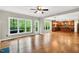 Open floor plan living and kitchen area features hardwood floors and lots of natural light at 104 Windorah Place Pl, Chapel Hill, NC 27517