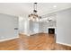 Open-concept living area with hardwood floors, fireplace, and seamless flow into other living spaces at 104 Windorah Place Pl, Chapel Hill, NC 27517