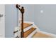 Close-up shot of a wood and white staircase with freshly painted walls at 104 Windorah Place Pl, Chapel Hill, NC 27517