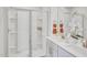 This bathroom has a double sink with a glass-enclosed shower at 1043 Winding Spring Dr, Mebane, NC 27302