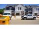 New construction townhomes featuring two-tone color schemes and attached garages at 1043 Winding Spring Dr, Mebane, NC 27302