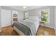 Comfortable bedroom with hardwood floors, a queen-sized bed, and ample natural light at 106 Bluefield Rd, Chapel Hill, NC 27517