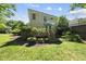 Back exterior of home featuring a wooden deck and a lush lawn at 106 Bluefield Rd, Chapel Hill, NC 27517