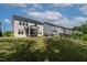 Spacious backyard with green lawn and a screened-in porch perfect for outdoor relaxation at 108 Valley View Dr, Chapel Hill, NC 27516