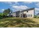 Expansive backyard featuring a screened-in porch and lush green grass at 108 Valley View Dr, Chapel Hill, NC 27516
