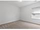 A bright, carpeted room with a window; ready for you to make it your own at 108 Valley View Dr, Chapel Hill, NC 27516