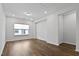 A bonus room features recessed lighting, wood floors, neutral paint, and a window for natural light at 108 Valley View Dr, Chapel Hill, NC 27516