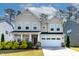Charming two-story home with a well-manicured lawn, attached garage, and lovely landscaping at 108 Valley View Dr, Chapel Hill, NC 27516