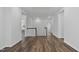 Open hallway with hardwood floors and white trim offering plenty of natural light and access to other rooms at 108 Valley View Dr, Chapel Hill, NC 27516