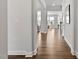 Hallway featuring hardwood floors and views into other rooms in the house at 108 Valley View Dr, Chapel Hill, NC 27516
