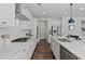 Contemporary kitchen with white cabinets, stainless steel appliances, and a spacious island with sink at 108 Valley View Dr, Chapel Hill, NC 27516