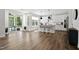 Spacious kitchen with a large island, white cabinets, and stainless steel appliances leading to a screened porch at 108 Valley View Dr, Chapel Hill, NC 27516