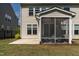 Close up of the screened porch with fan and outdoor seating area at 108 Valley View Dr, Chapel Hill, NC 27516
