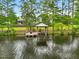 Breathtaking aerial view of the home, dock, and serene lake at 1093 N Lakeside Dr, Smithfield, NC 27577